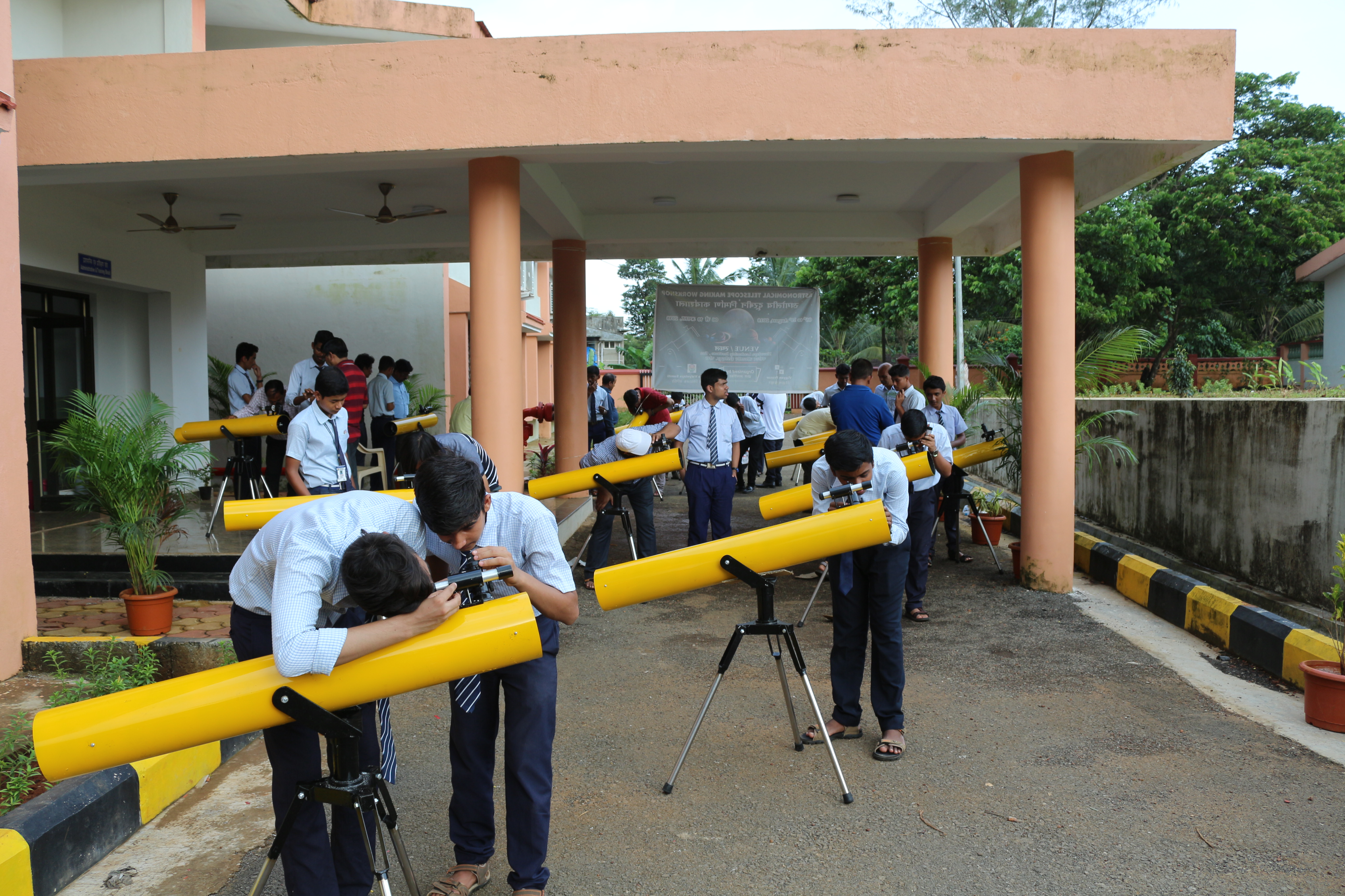 Students and teachers of JNVS making telescope during telescope making programme 